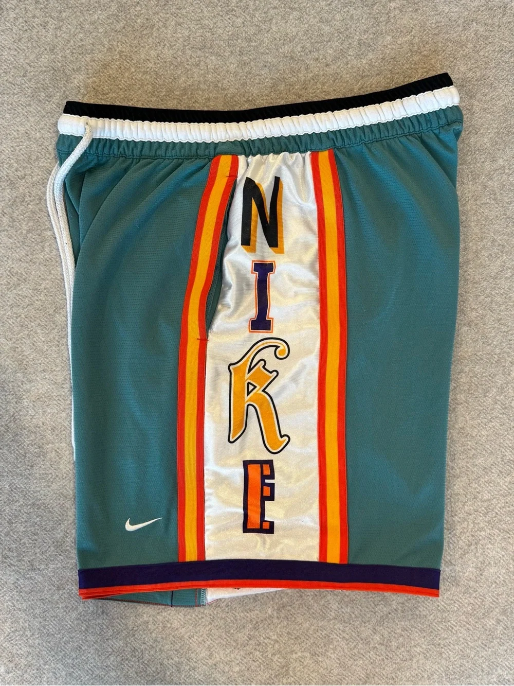 Nike Teal Basketball Shorts with Multicolor Side Panels